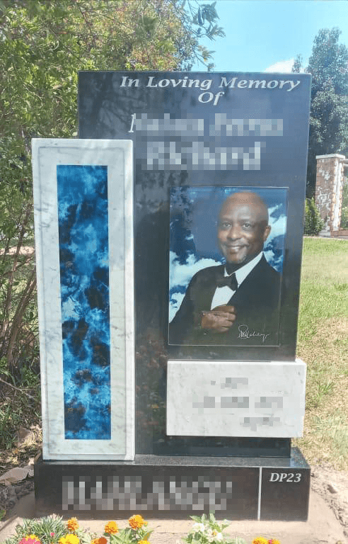 Glass memorial mounted on granite base