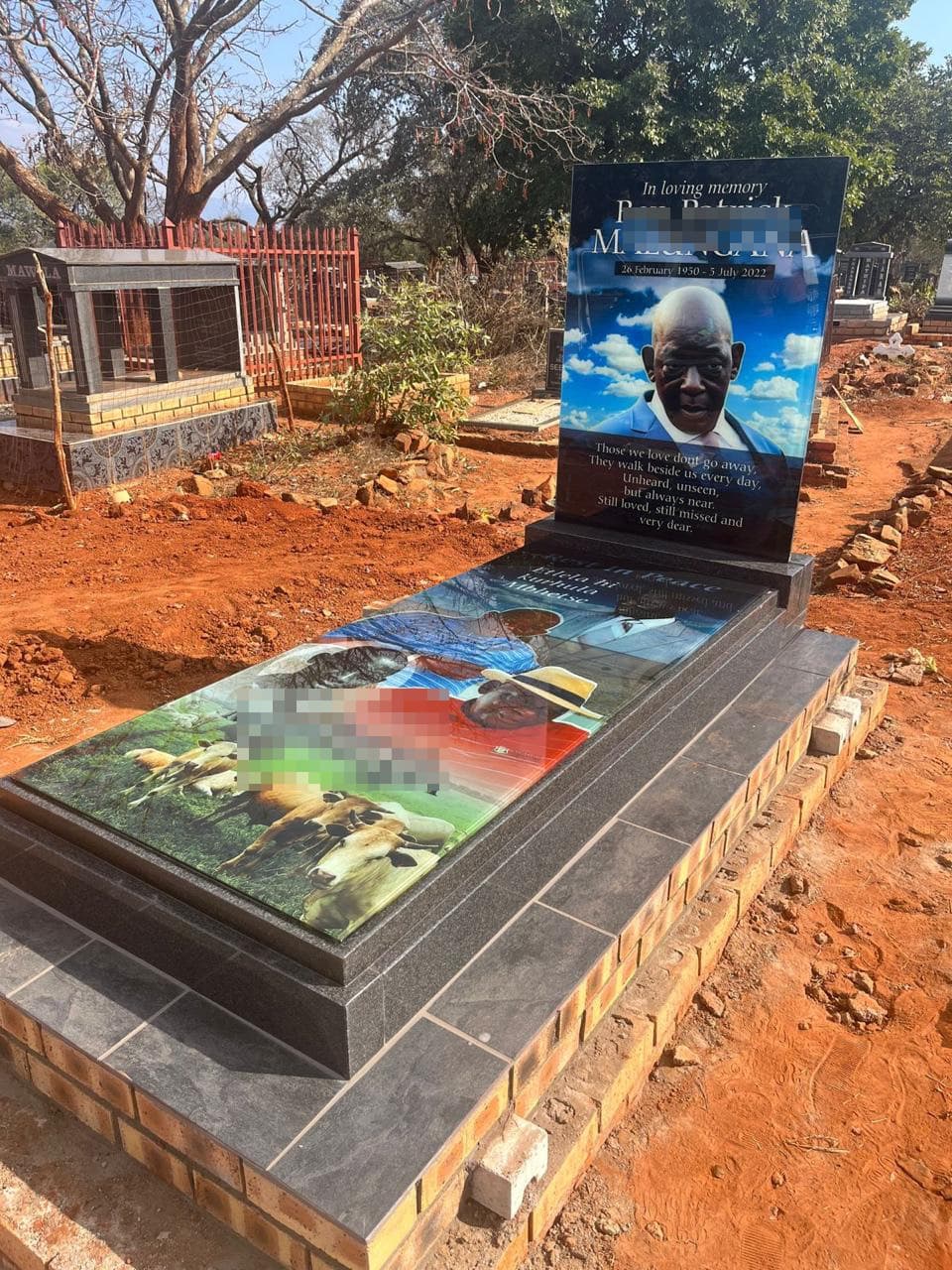 Glass memorial in cemetery setting