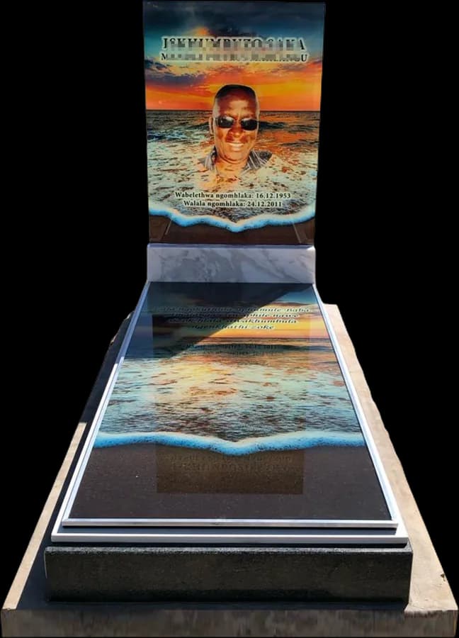 Full glass tombstone with a photo headstone and a glass ledger over the grave